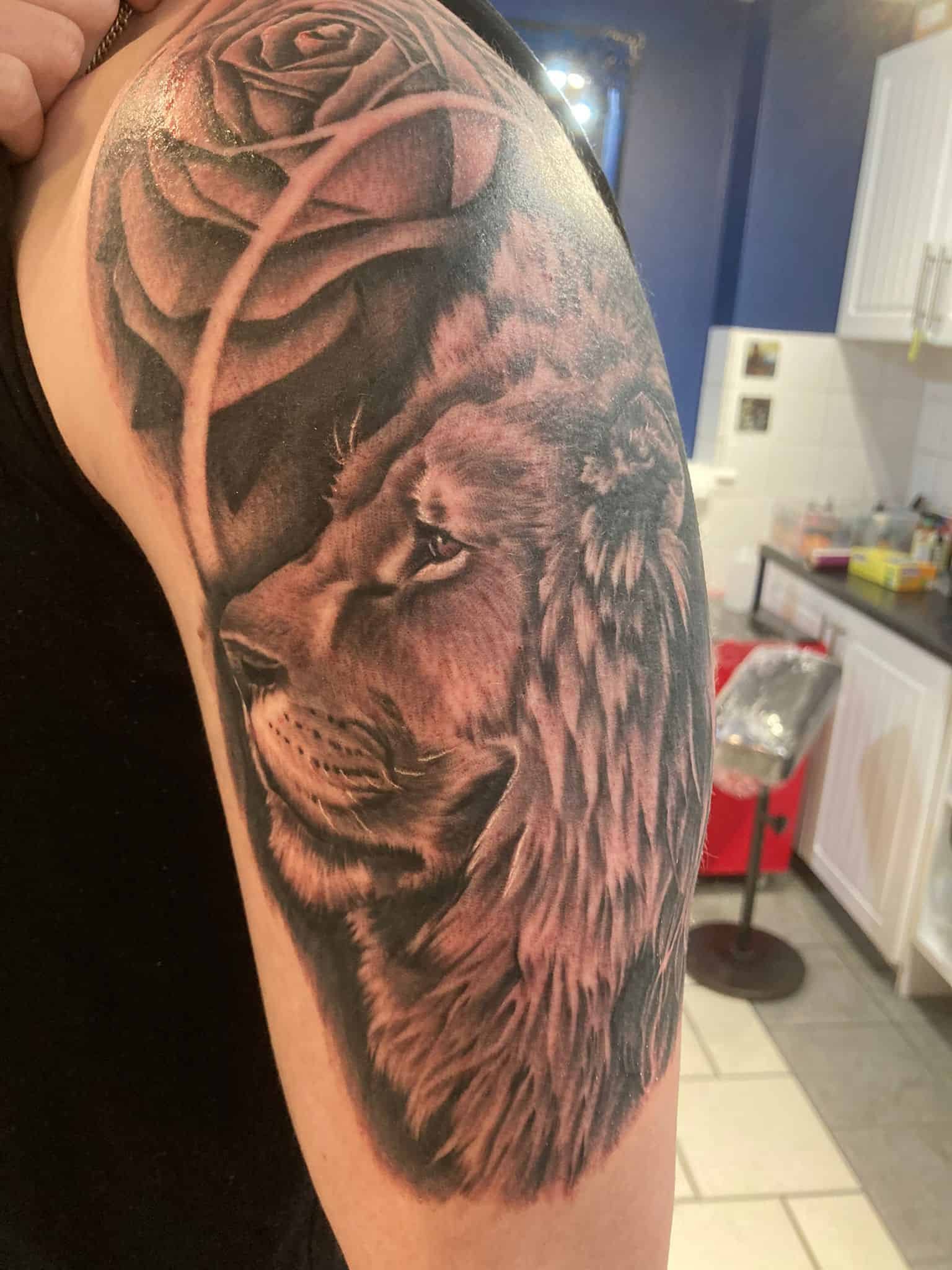 a lion tattoo on the arm